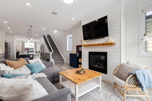 4629 72 Street Nw, Calgary, AB - Indoor Photo Showing Living Room With Fireplace