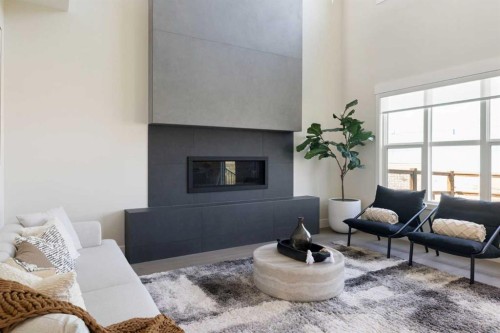 14 Opal Place, Balzac, AB - Indoor Photo Showing Living Room With Fireplace