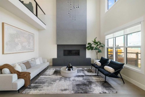 14 Opal Place, Balzac, AB - Indoor Photo Showing Living Room With Fireplace