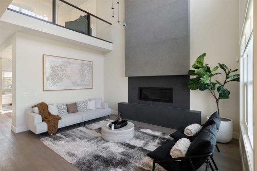 14 Opal Place, Balzac, AB - Indoor Photo Showing Living Room With Fireplace