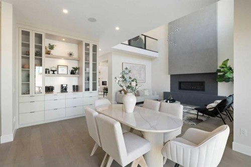 14 Opal Place, Balzac, AB - Indoor Photo Showing Dining Room With Fireplace
