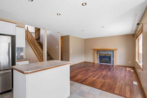 144 Douglas Ridge Close Se, Calgary, AB - Indoor Photo Showing Living Room With Fireplace