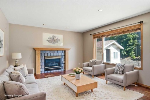 144 Douglas Ridge Close Se, Calgary, AB - Indoor Photo Showing Living Room With Fireplace