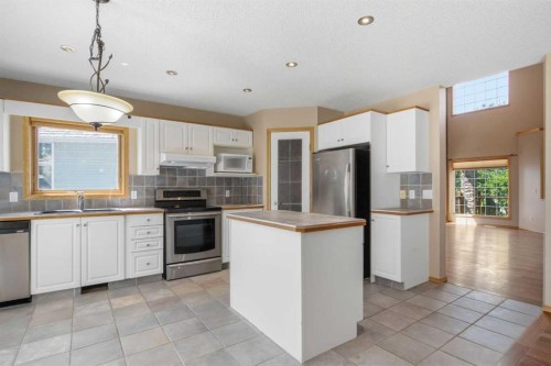 144 Douglas Ridge Close Se, Calgary, AB - Indoor Photo Showing Kitchen With Stainless Steel Kitchen