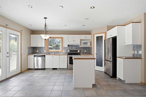 144 Douglas Ridge Close Se, Calgary, AB - Indoor Photo Showing Kitchen With Stainless Steel Kitchen