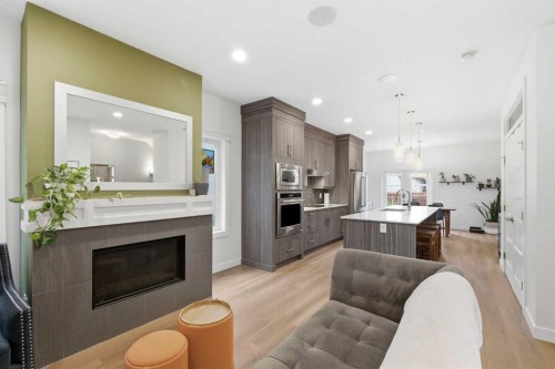 5-308 11 Avenue Ne, Calgary, AB - Indoor Photo Showing Other Room With Fireplace