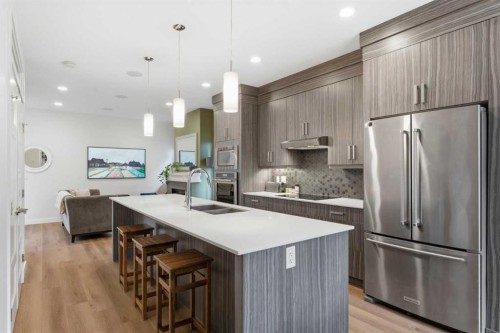 5-308 11 Avenue Ne, Calgary, AB - Indoor Photo Showing Kitchen With Stainless Steel Kitchen With Double Sink With Upgraded Kitchen