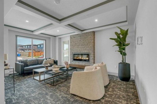 315-55 Wolf Hollow Crescent Se, Calgary, AB - Indoor Photo Showing Living Room With Fireplace