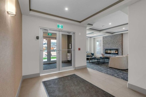 315-55 Wolf Hollow Crescent Se, Calgary, AB - Indoor Photo Showing Other Room With Fireplace