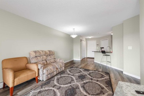207-5 Saddlestone Way Ne, Calgary, AB - Indoor Photo Showing Living Room