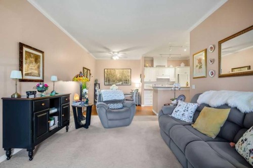 302-15 Lineham Avenue, Okotoks, AB - Indoor Photo Showing Living Room