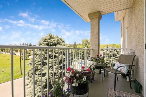 302-15 Lineham Avenue, Okotoks, AB - Outdoor With Exterior