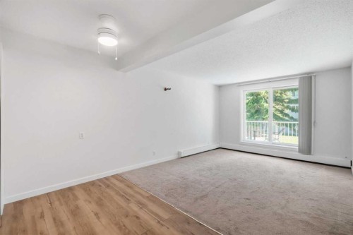 203B-5601 Dalton Drive Nw, Calgary, AB - Indoor Photo Showing Other Room