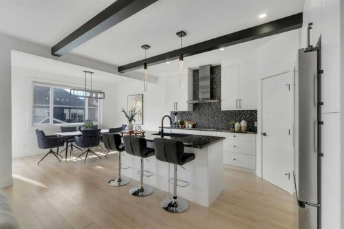 247 Coopers Cove Sw, Airdrie, AB - Indoor Photo Showing Kitchen With Upgraded Kitchen