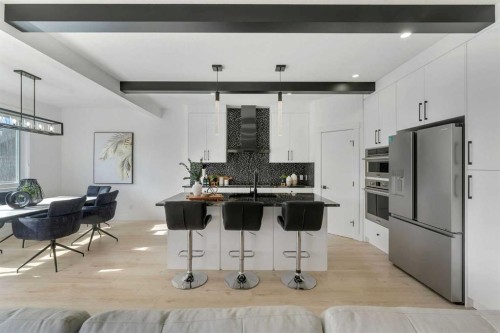 247 Coopers Cove Sw, Airdrie, AB - Indoor Photo Showing Kitchen With Upgraded Kitchen