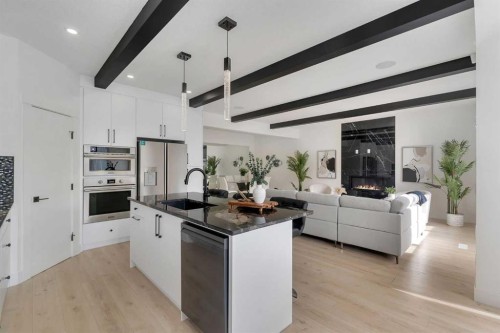247 Coopers Cove Sw, Airdrie, AB - Indoor Photo Showing Kitchen With Upgraded Kitchen