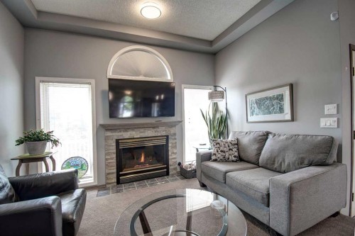 2391 Morris Crescent Se, Airdrie, AB - Indoor Photo Showing Living Room With Fireplace