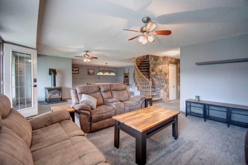 2391 Morris Crescent Se, Airdrie, AB - Indoor Photo Showing Living Room With Fireplace