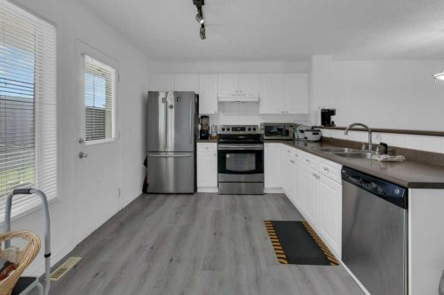 109 Tuscany Springs Gardens Nw, Calgary, AB - Indoor Photo Showing Kitchen With Double Sink