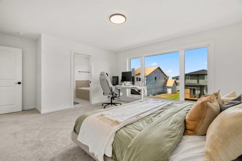 380 Northern Lights Green, Langdon, AB - Indoor Photo Showing Bedroom