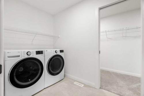380 Northern Lights Green, Langdon, AB - Indoor Photo Showing Laundry Room