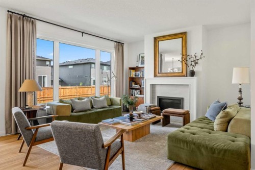 380 Northern Lights Green, Langdon, AB - Indoor Photo Showing Living Room With Fireplace