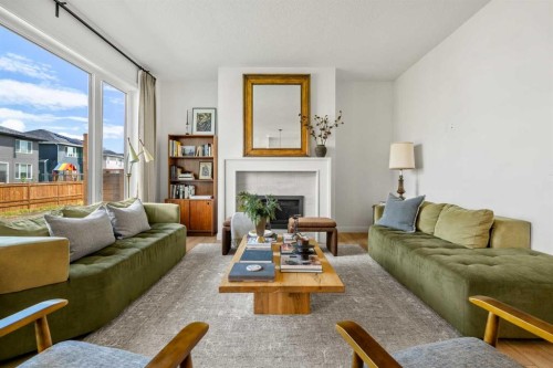 380 Northern Lights Green, Langdon, AB - Indoor Photo Showing Living Room With Fireplace
