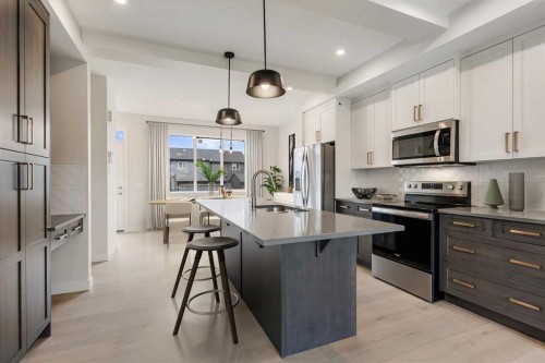 263 Waterford Heights, Chestermere, AB - Indoor Photo Showing Kitchen With Upgraded Kitchen
