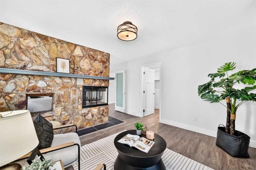 884 East Chestermere Drive, Chestermere, AB - Indoor Photo Showing Living Room With Fireplace