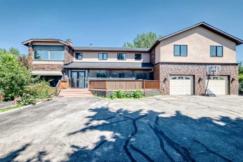 884 East Chestermere Drive, Chestermere, AB - Outdoor With Deck Patio Veranda With Facade