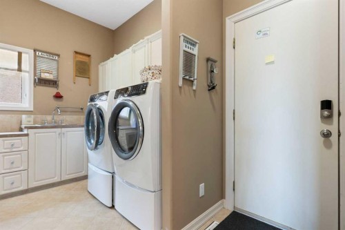 112 Gleneagles View, Cochrane, AB - Indoor Photo Showing Laundry Room