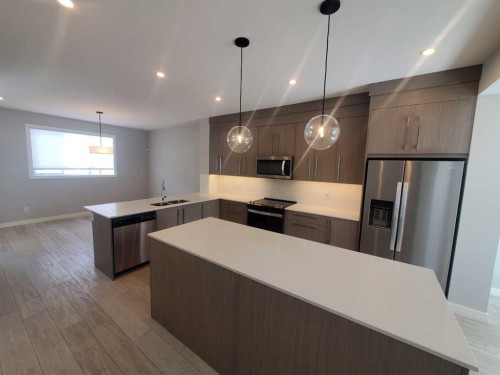 1045 West Lakeview Drive, Chestermere, AB - Indoor Photo Showing Kitchen With Stainless Steel Kitchen With Double Sink With Upgraded Kitchen