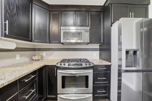 759 Stonehaven Drive, Carstairs, AB - Indoor Photo Showing Kitchen With Stainless Steel Kitchen With Upgraded Kitchen