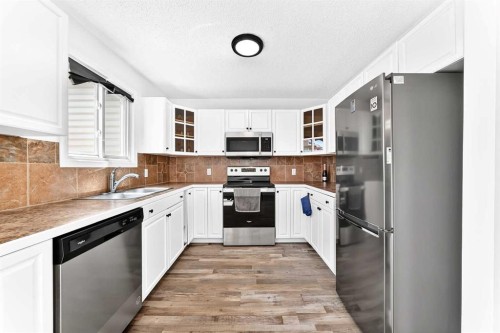 3728 Cedarille Drive Sw, Calgary, AB - Indoor Photo Showing Kitchen With Stainless Steel Kitchen With Double Sink