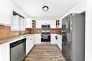 3728 Cedarille Drive Sw, Calgary, AB  - Indoor Photo Showing Kitchen With Stainless Steel Kitchen With Double Sink 