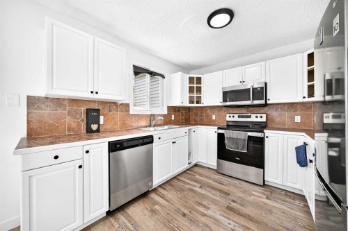 3728 Cedarille Drive Sw, Calgary, AB - Indoor Photo Showing Kitchen With Stainless Steel Kitchen