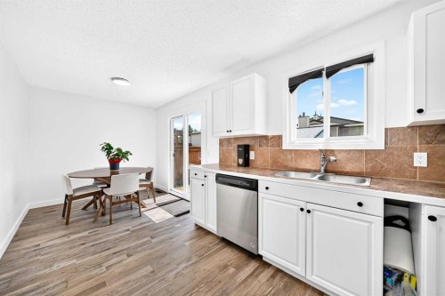 3728 Cedarille Drive Sw, Calgary, AB - Indoor Photo Showing Kitchen With Double Sink