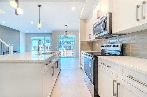 124 Waterford Way, Chestermere, AB - Indoor Photo Showing Kitchen With Upgraded Kitchen