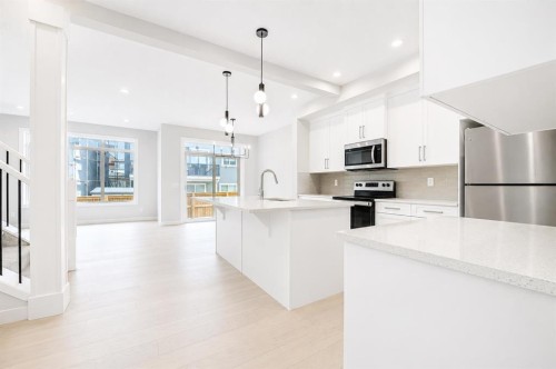 124 Waterford Way, Chestermere, AB - Indoor Photo Showing Kitchen With Upgraded Kitchen