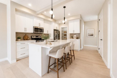 124 Waterford Way, Chestermere, AB - Indoor Photo Showing Kitchen With Upgraded Kitchen