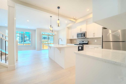 124 Waterford Way, Chestermere, AB - Indoor Photo Showing Kitchen With Upgraded Kitchen