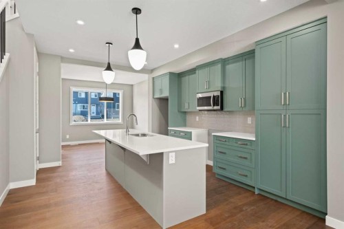 644 Sora Boulevard Se, Calgary, AB - Indoor Photo Showing Kitchen With Double Sink With Upgraded Kitchen