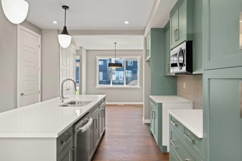644 Sora Boulevard Se, Calgary, AB - Indoor Photo Showing Kitchen With Double Sink