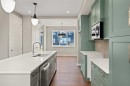 644 Sora Boulevard Se, Calgary, AB  - Indoor Photo Showing Kitchen With Double Sink 