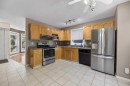 75 Everglade Drive Se, Airdrie, AB  - Indoor Photo Showing Kitchen With Double Sink 