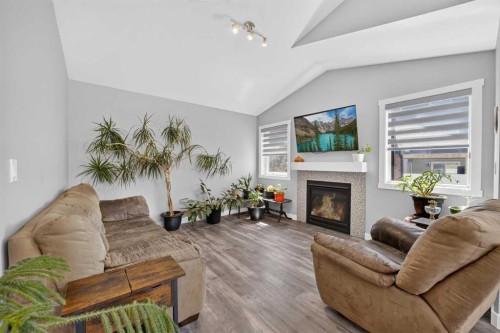 36 Cameron Close, Sylvan Lake, AB - Indoor Photo Showing Living Room With Fireplace