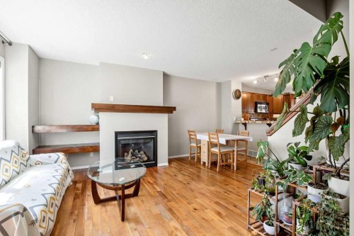 275 Everstone Drive Sw, Calgary, AB - Indoor Photo Showing Living Room With Fireplace