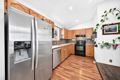 32 Cimarron Meadows Way, Okotoks, AB - Indoor Photo Showing Kitchen With Double Sink