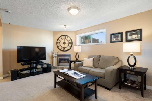 32 Beddington Road Ne, Calgary, AB - Indoor Photo Showing Living Room With Fireplace