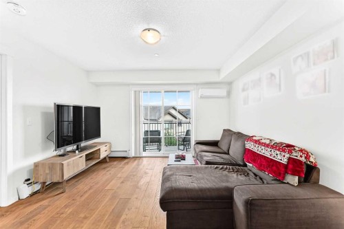 4302-755 Copperpond Boulevard Se, Calgary, AB - Indoor Photo Showing Living Room